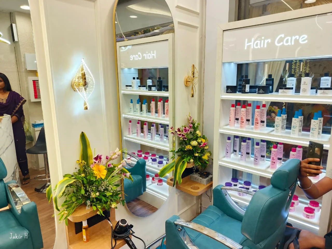 Professional hair care product shelf beside a styling station