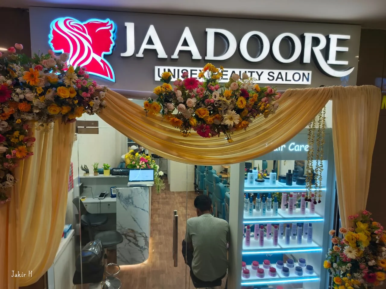 Salon entrance decorated with marigold floral garlands